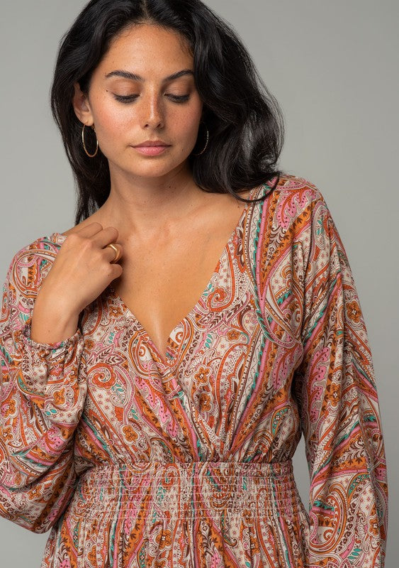 Brunette female model wearing bohemian print dress