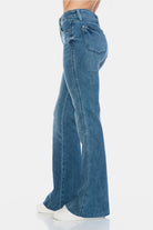 Judy Blue Mid Rise Tummy Control Cut Hem Flare Jeans in Vintage Wash  side view styled with white sneakers