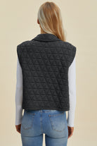 Back View of Quilted Textured Black Vest  on model with jeans