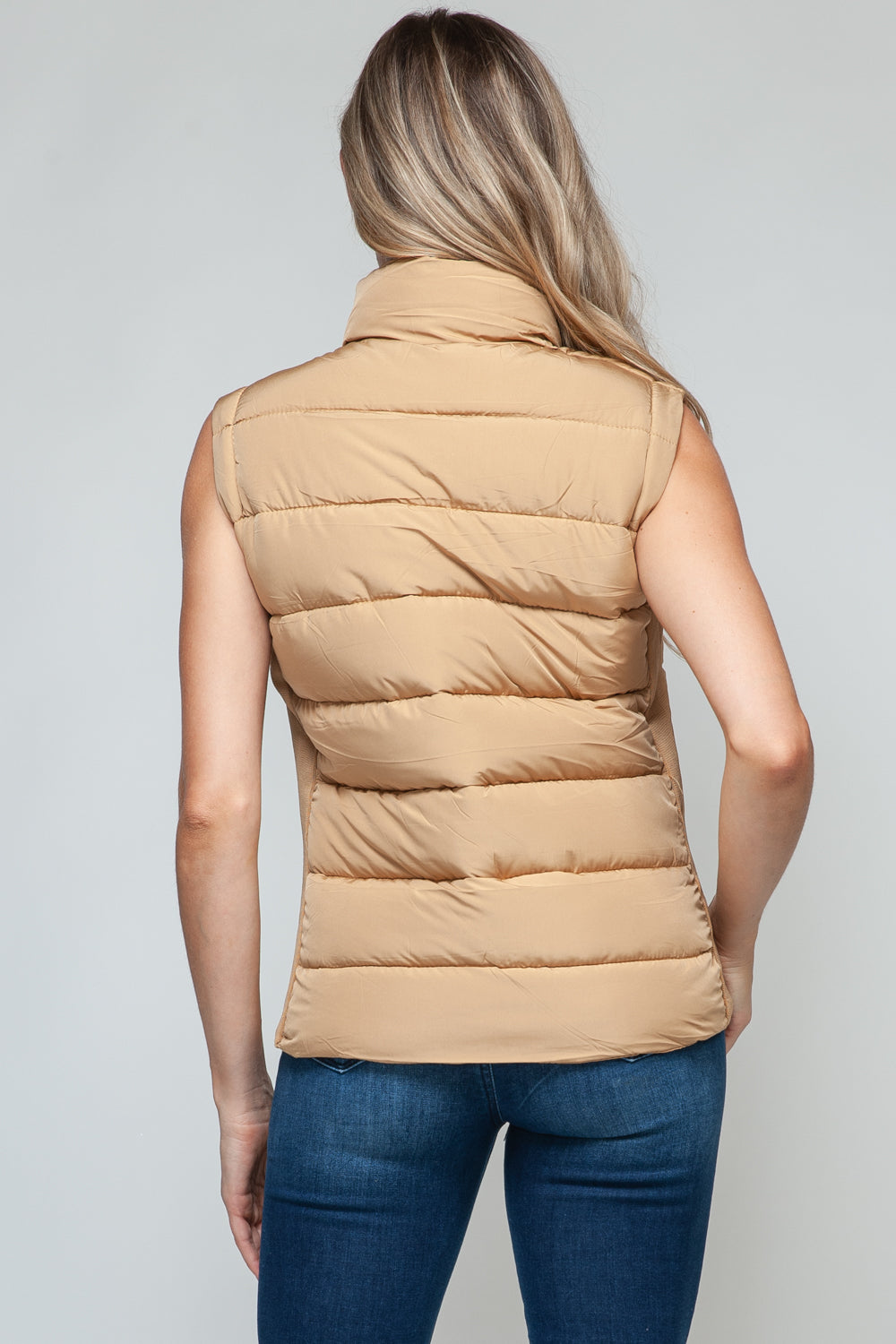 Back of tan puffer vest