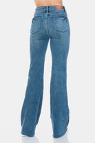 Judy Blue Mid Rise Tummy Control Cut Hem Flare Jeans in Vintage Wash back view on model