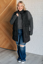 Black and white striped long sleeve top styled with long vest on Jordan