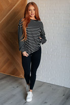 Black and white striped long sleeve top with leggings on Sarah