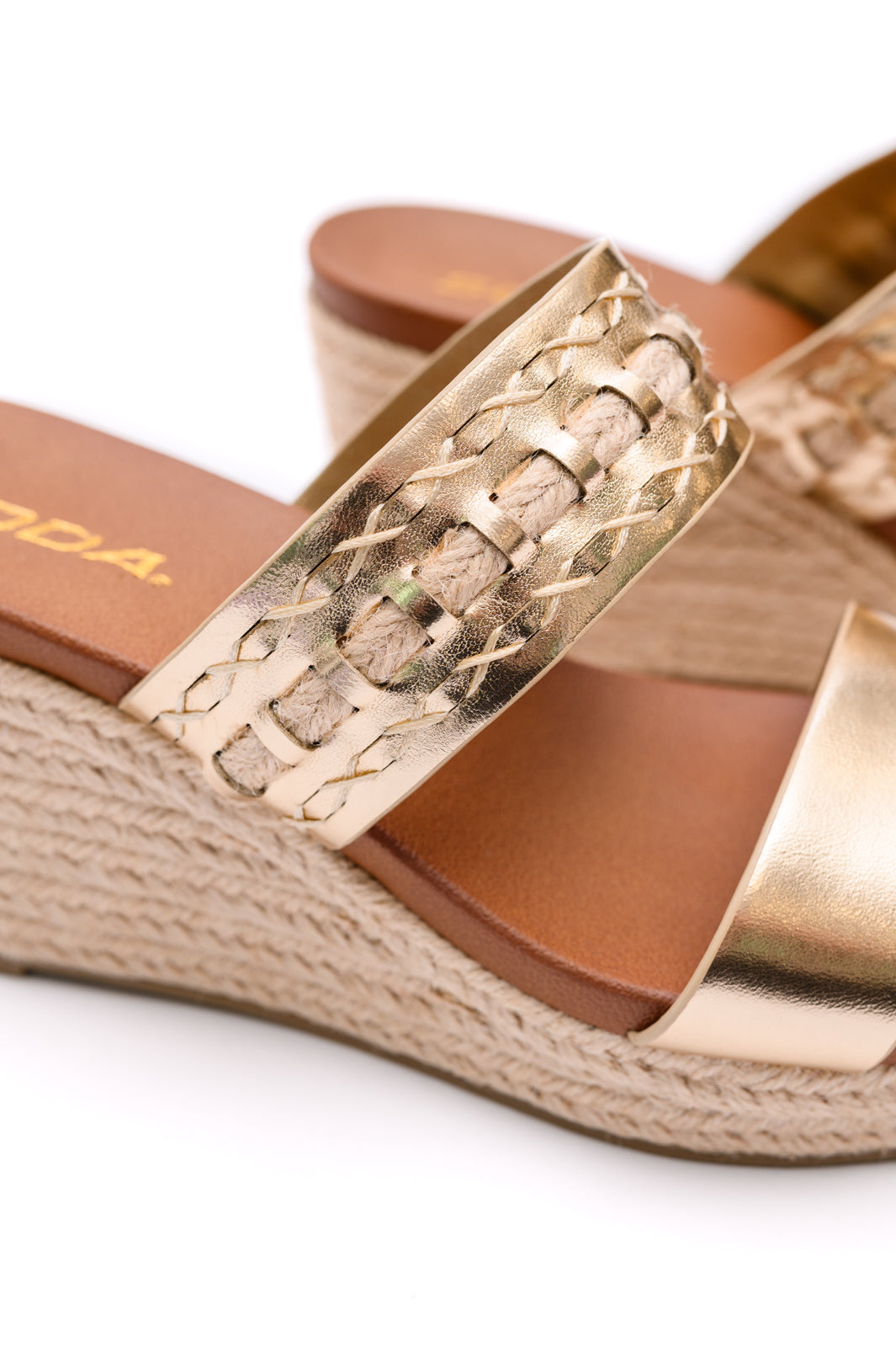 Soda brand wedge shoes with gold tone straps and braded cloth wedge detail