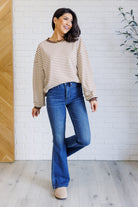 Brown and white long sleeve top with brown cuffs and collar styled with Judy Blue jeans