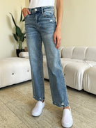 Judy Blue Destroyed Jeans in Medium Wash styled with white shoes