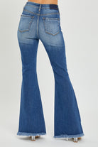 RISEN High Rise Front Slit Frayed Hem Flare Jeans in Dark Wash back view