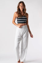 White rouched waisted comfortable pants on model wearing a small